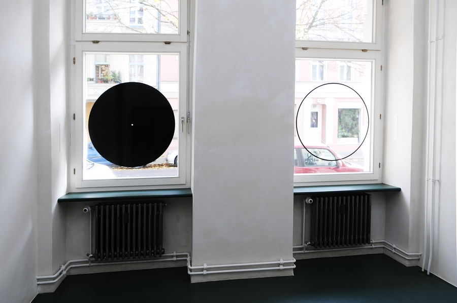 Two single holes, 2013. Black adhesive foil, diameter 80 cm each. Inside view.